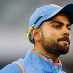 Virat-Kohli-of-India-points-to-the-India-logo-on-his-clothing-as-he-gestures-to-fans-3
